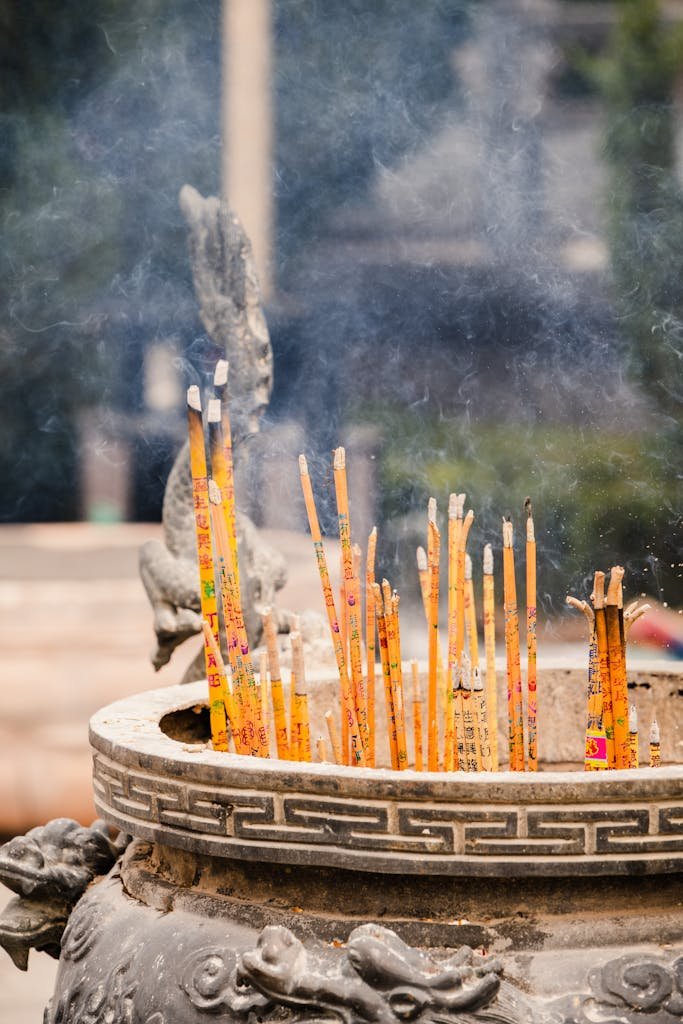 Intricate incense burner with smoking sticks captures the essence of spiritual tradition and cultural heritage.